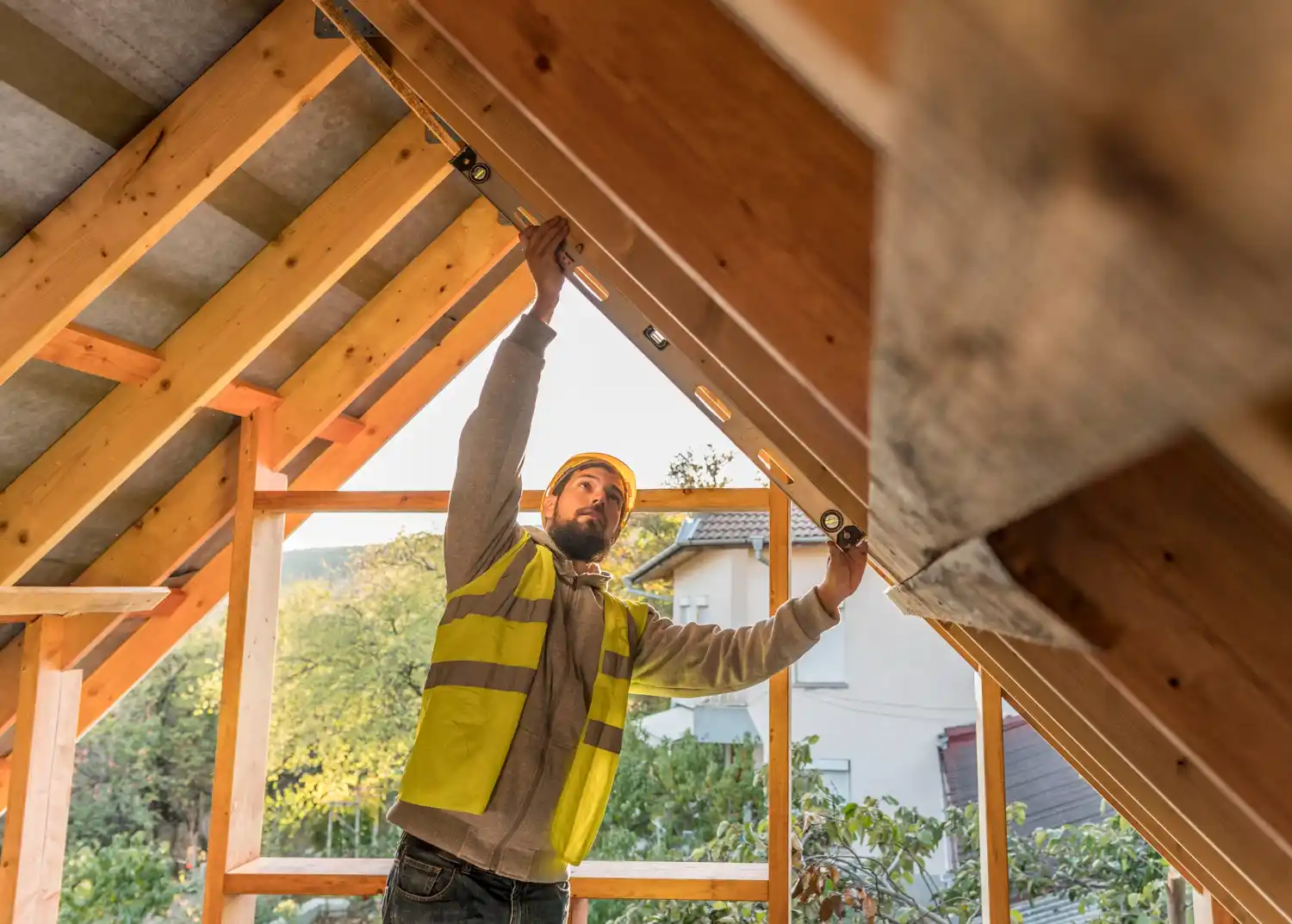 Professional inspecting attic for roof leaks, mold, and structural damage