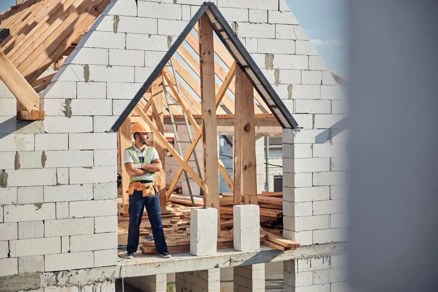 Contractors replacing old exterior siding with durable modern materials