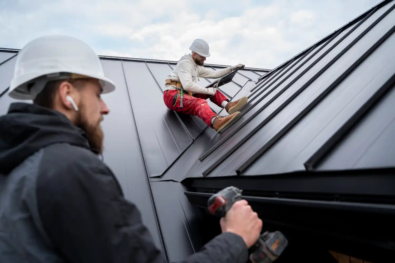 Emergency roofing specialists repairing severe roof leak in Morgantown KY after heavy storm and rainfall damage.
