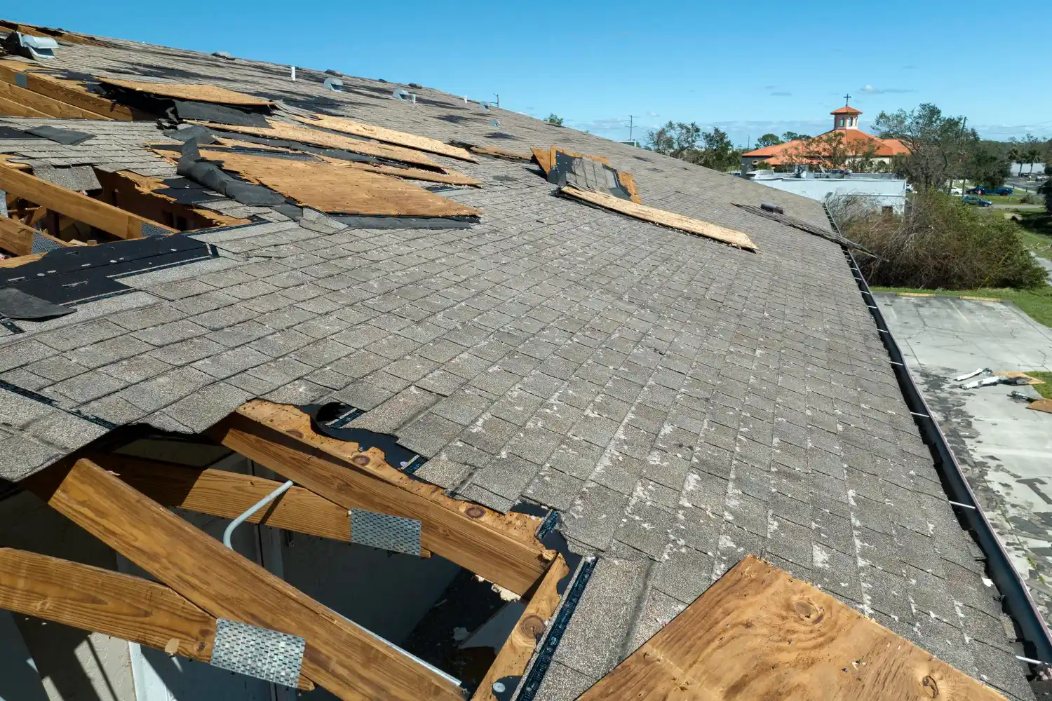 Technician repairing roof leak to prevent interior water damage
