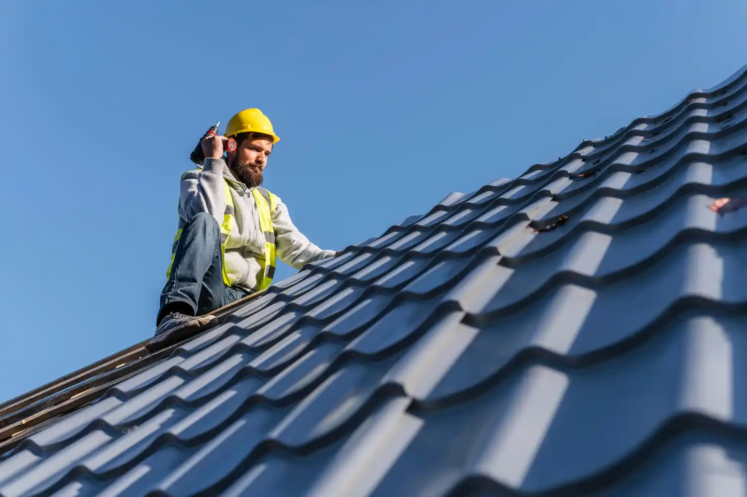 Contractor inspecting roof condition from ground level using visual assessment