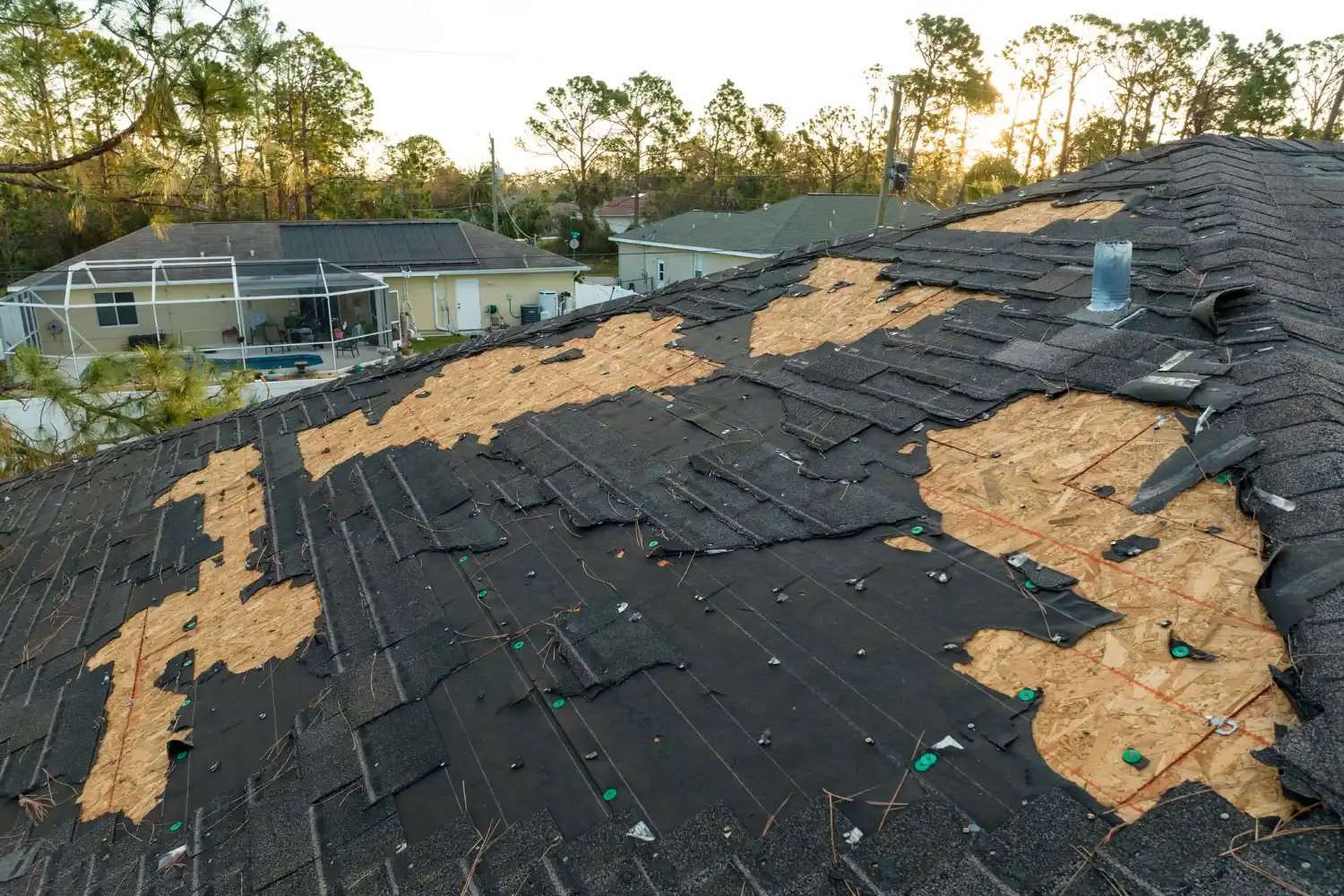 Inspector checking ceiling and interior walls for roof leak damage