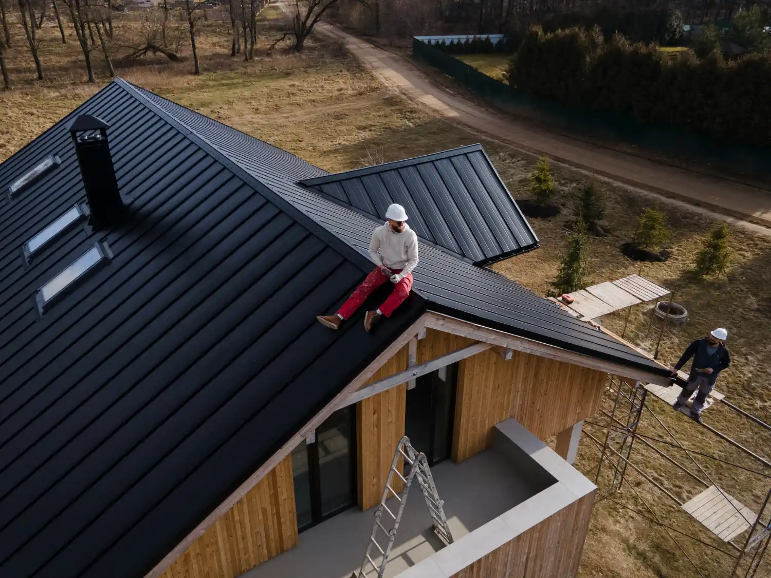 Experienced roofer inspecting damaged roof in Plano KY to identify leaks, missing shingles, and structural issues.