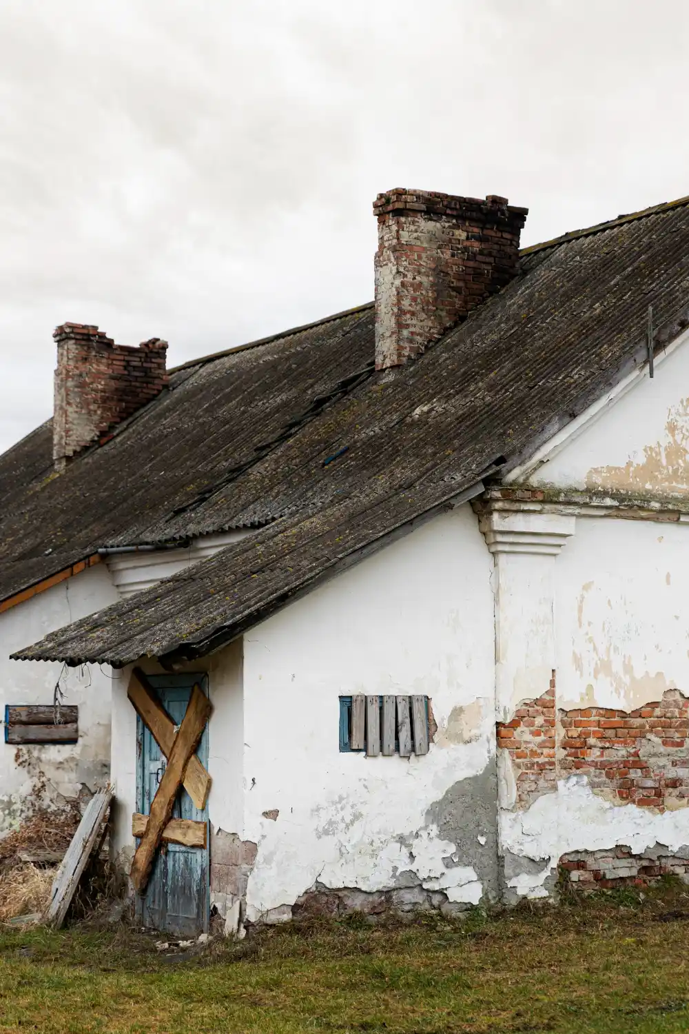 Roofer repairing roof damaged by strong winds and storms